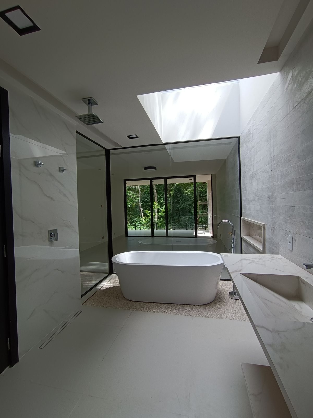 A freestanding tub in soft natural light